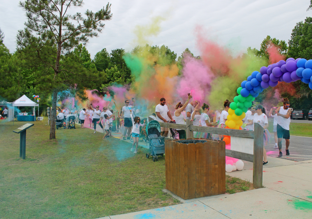People tossing color at an event