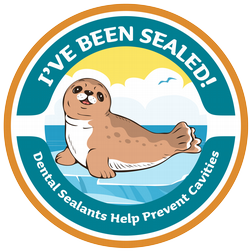 Logo with a smiling cartoon seal on an iceberg with text stating, "I've been sealed! Dental sealant help prevent cavities."